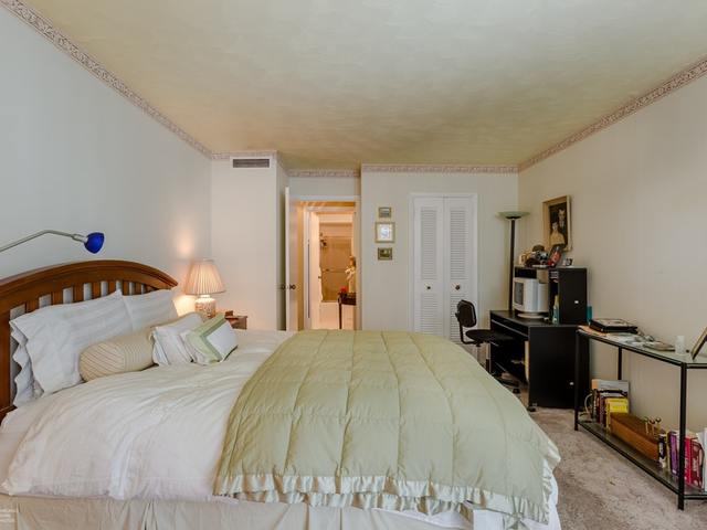 5901 North Sheridan Road, Unit 6G Chicago, IL 60660 - Photo 16 of 24 a bedroom with a bed and a dresser