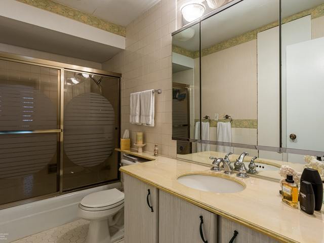 5901 North Sheridan Road, Unit 6G Chicago, IL 60660 - Photo 17 of 24 a bathroom with a sink toilet and shower