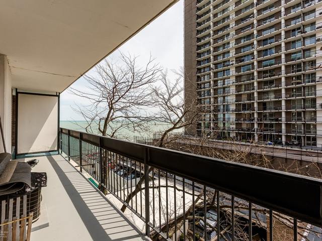5901 North Sheridan Road, Unit 6G Chicago, IL 60660 - Photo 19 of 24 a view of balcony with wooden floor and fence