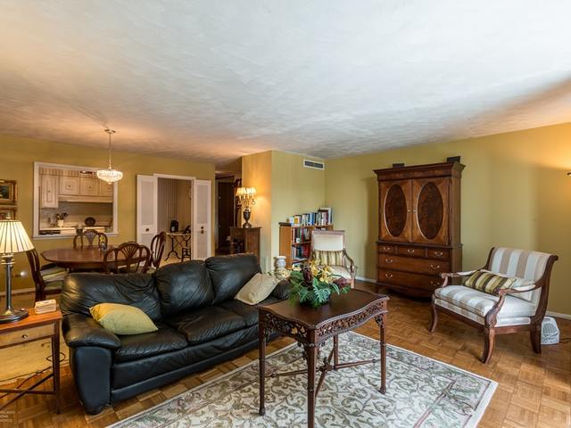 5901 North Sheridan Road, Unit 6G Chicago, IL 60660 - Photo 8 of 24 a living room with furniture and a wooden floor