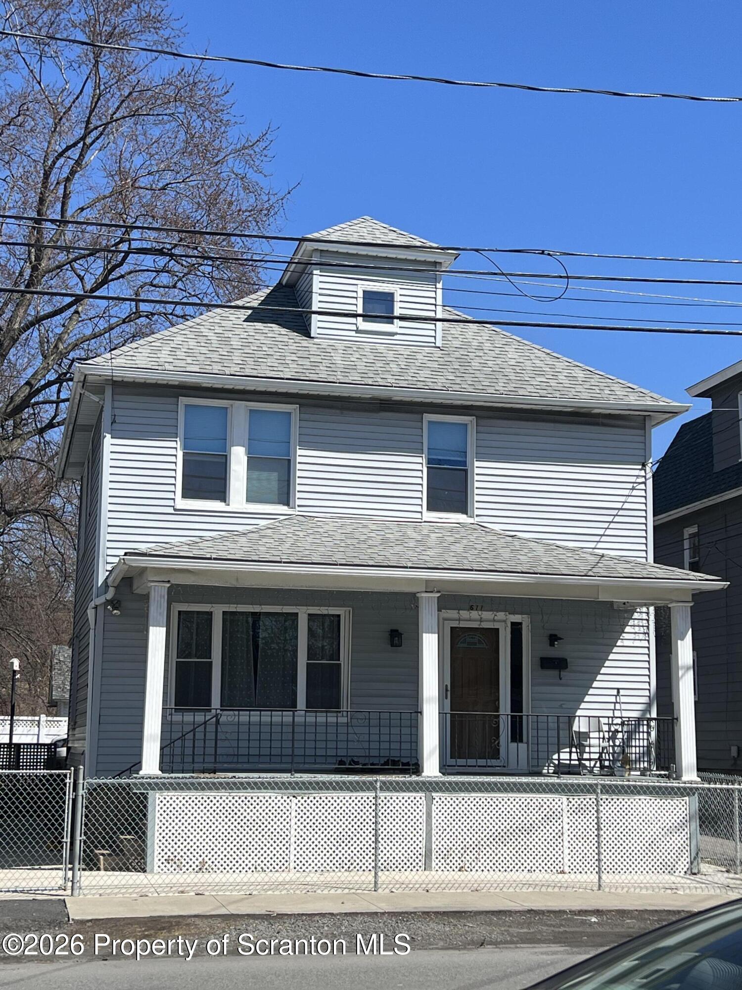 611 Moosic Street Scranton, PA 18505 - Photo 1 of 24 a front view of a house with a garage