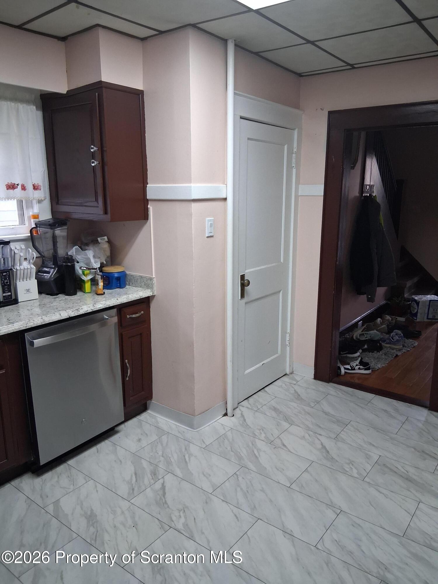 611 Moosic Street Scranton, PA 18505 - Photo 12 of 24 a kitchen with stainless steel appliances granite countertop a refrigerator and a stove