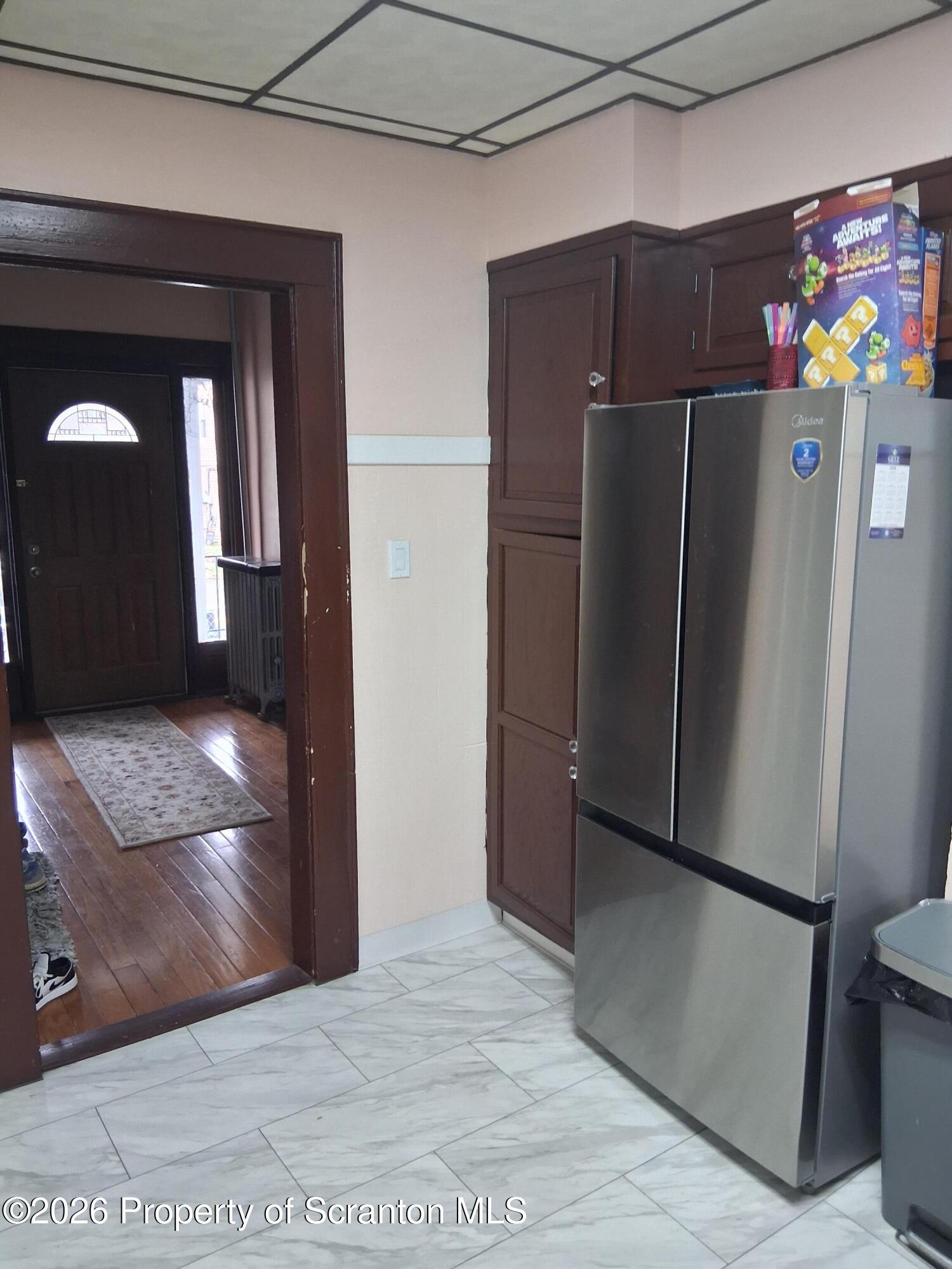 611 Moosic Street Scranton, PA 18505 - Photo 13 of 24 a kitchen with granite countertop a refrigerator and a sink