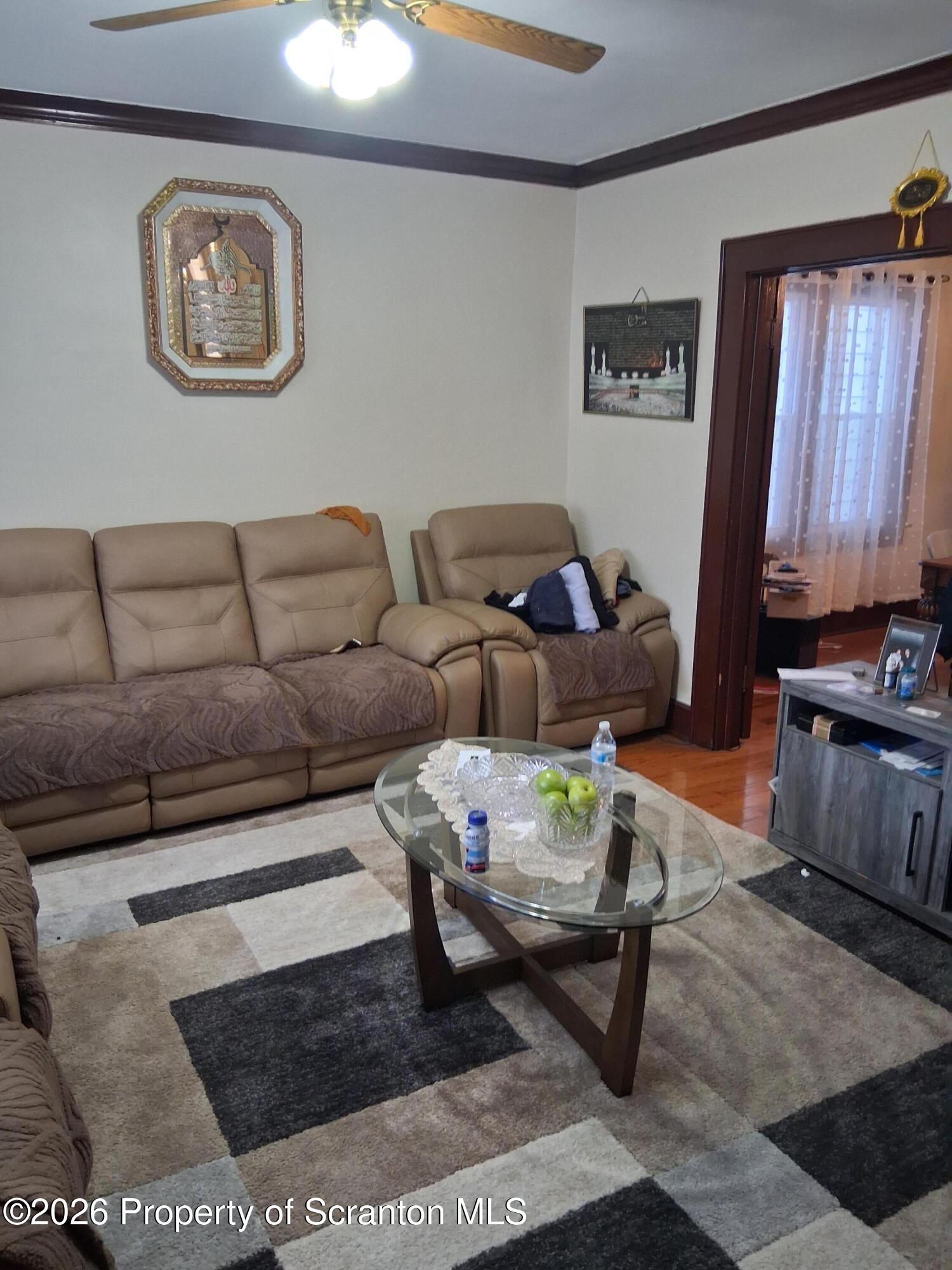 611 Moosic Street Scranton, PA 18505 - Photo 7 of 24 a living room with furniture and a window