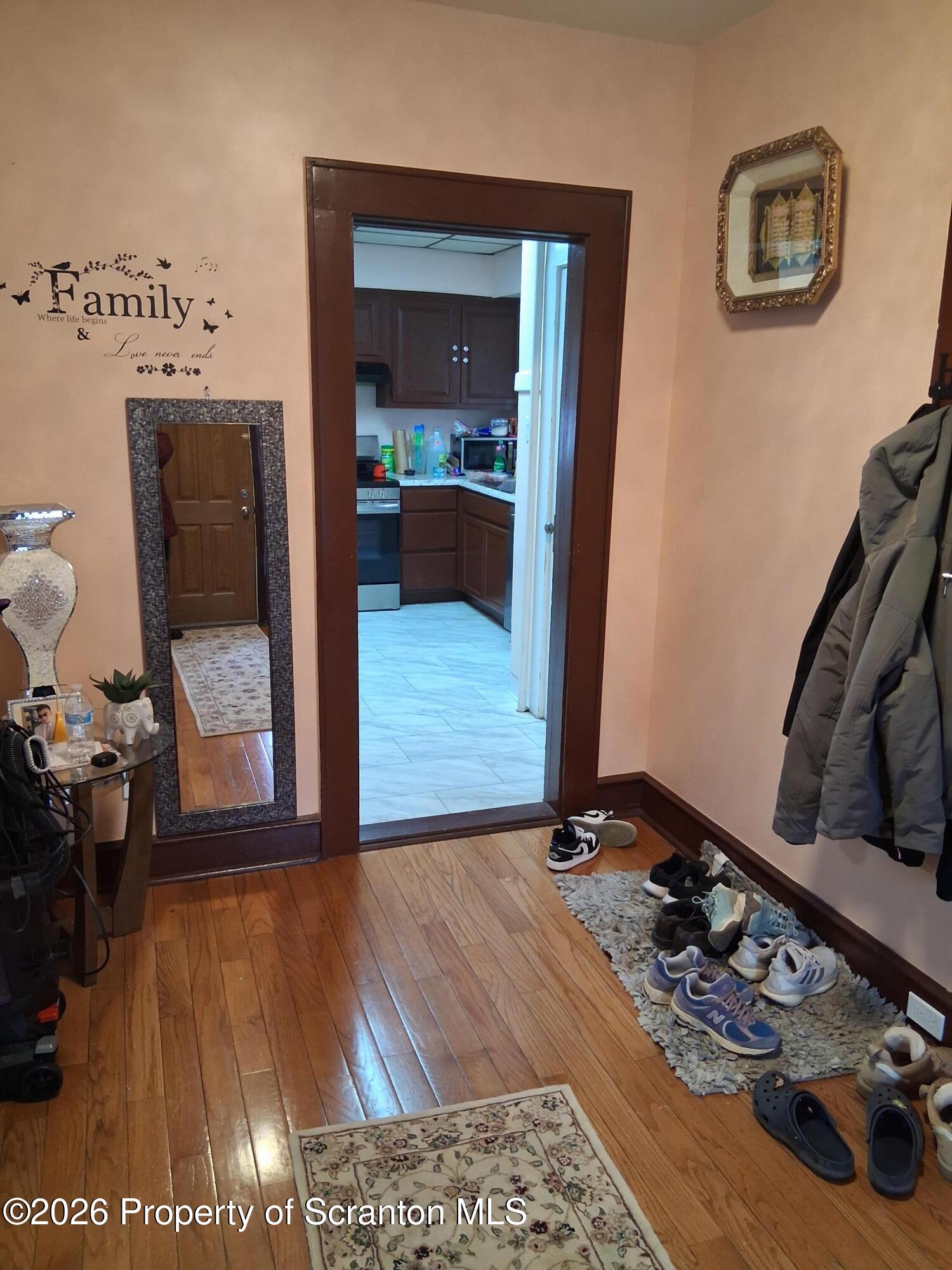 611 Moosic Street Scranton, PA 18505 - Photo 10 of 24 a view of a hallway with wooden floor and furniture