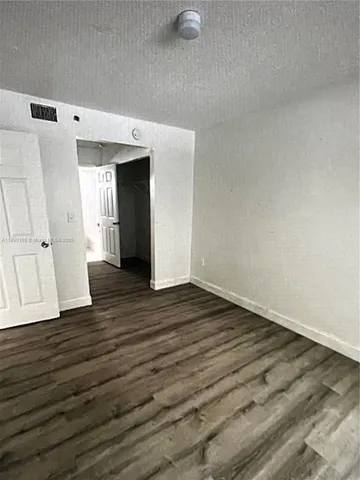 a view of a livingroom with wooden floor