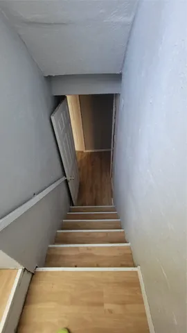 a view of an empty room with a closet