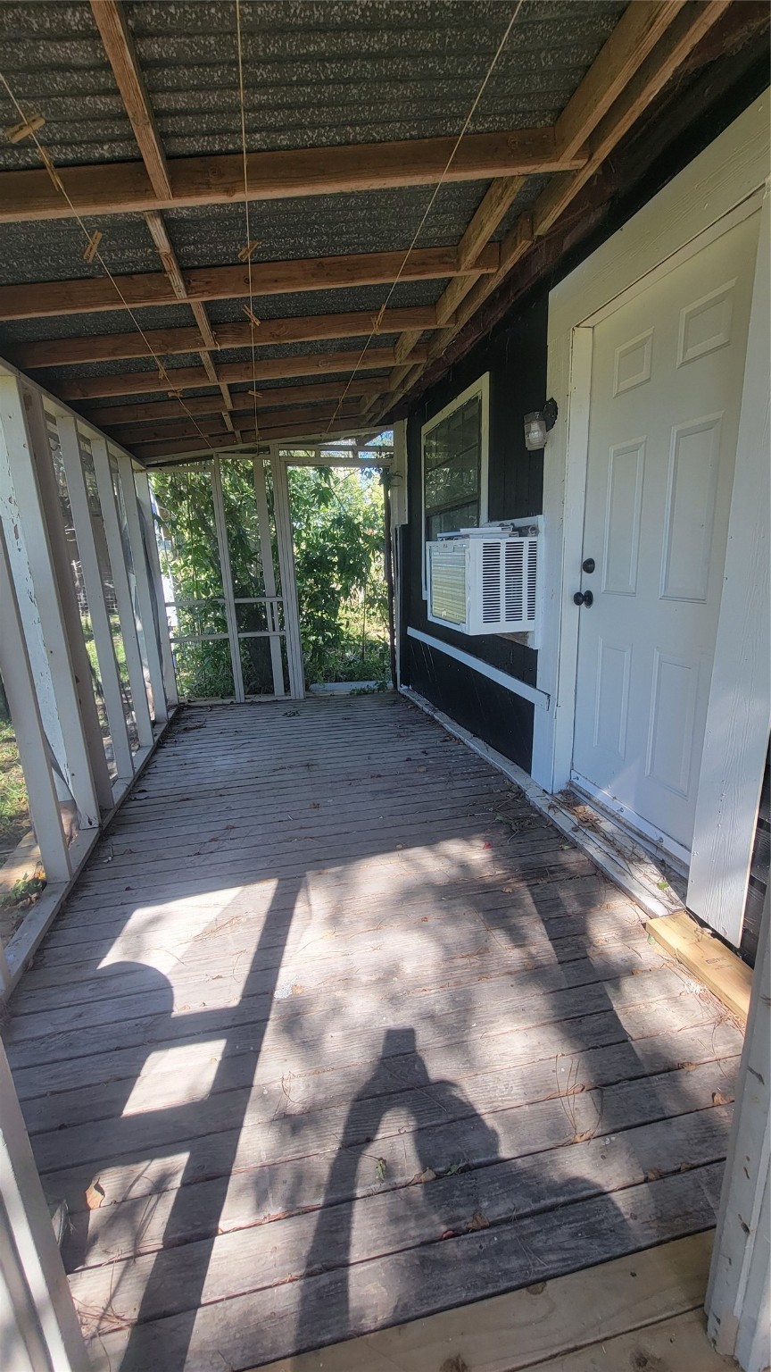 12018 Sandpiper Road Angleton, TX 77515 - Photo 3 of 48 a view of backyard with wooden floor and roof
