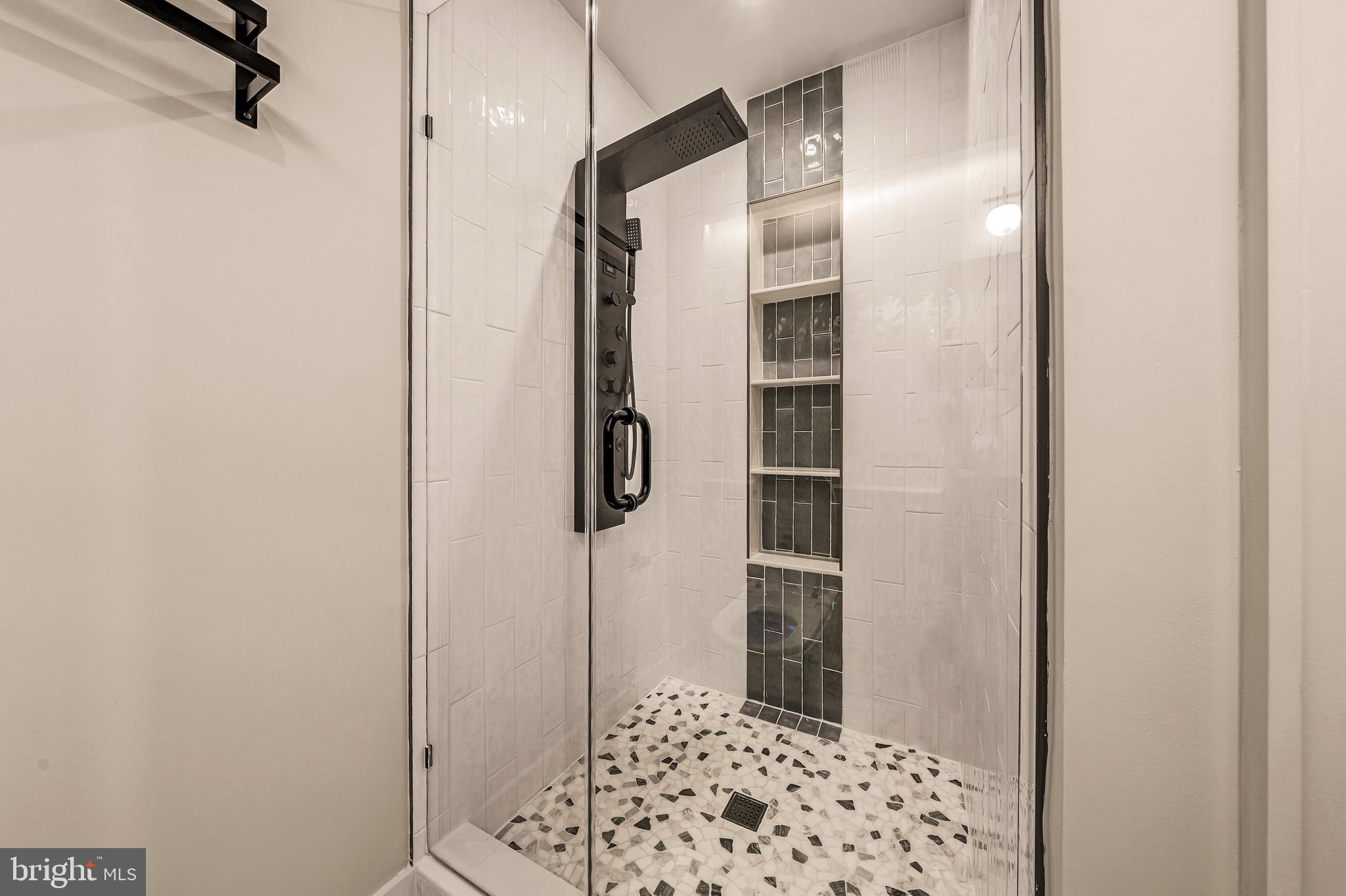 5921 Chesterbrook Road McLean, VA 22101 - Photo 55 of 76 a bathroom with a shower and a sink