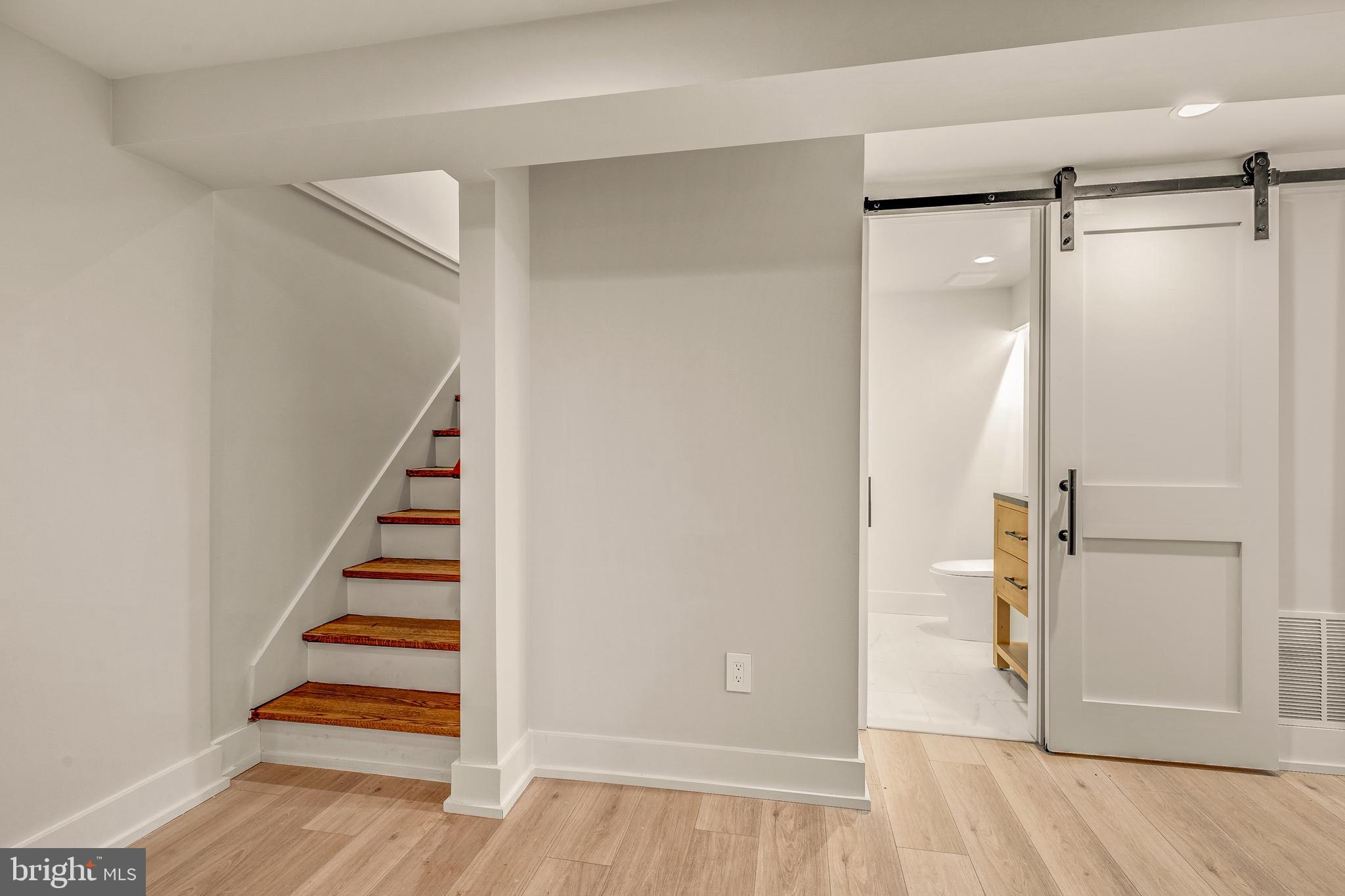 5921 Chesterbrook Road McLean, VA 22101 - Photo 65 of 76 a view of entryway with wooden floor and staircase