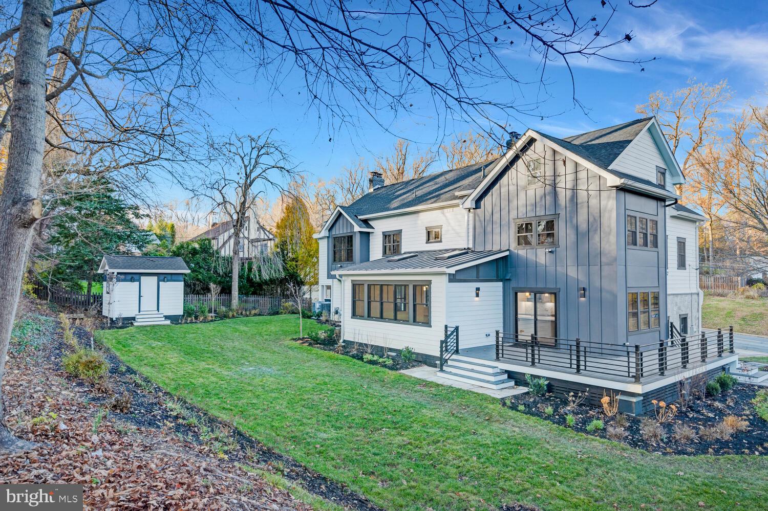 5921 Chesterbrook Road McLean, VA 22101 - Photo 73 of 76 a backyard of a house with table and chairs