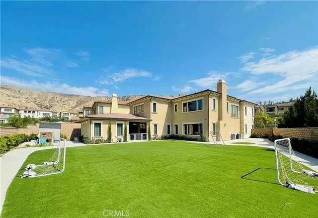 a view of a house with a big yard