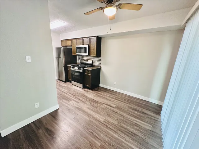 a view of a kitchen from the hallway