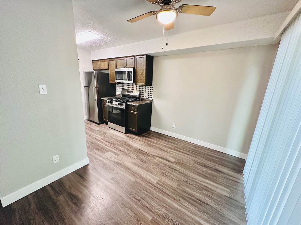 1314 Southport Drive, Unit C Austin, TX 78704 - Photo 2 of 22 a view of a kitchen from the hallway