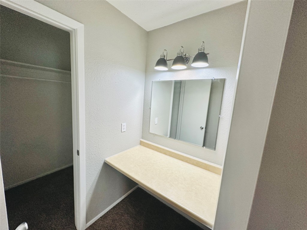 1314 Southport Drive, Unit C Austin, TX 78704 - Photo 21 of 22 a bathroom with a sink and a mirror