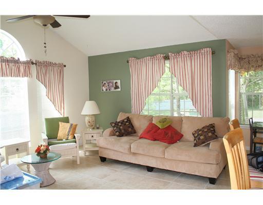 1335 Crystal Way, Unit J Delray Beach, FL 33444 - Photo 2 of 6 a living room with furniture and a large window