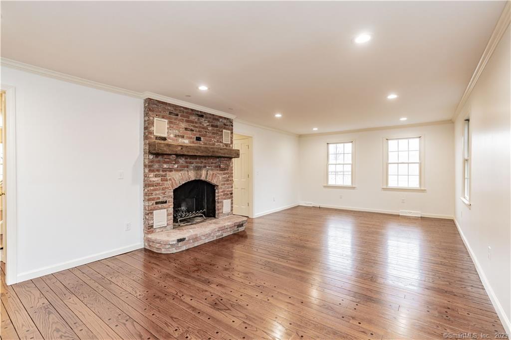 1241 Halladay Avenue West Suffield, CT 06078 - Photo 12 of 29 a view of a livingroom with a fireplace wooden floor and window