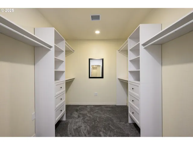 a bathroom with a sink a large mirror and a bathtub