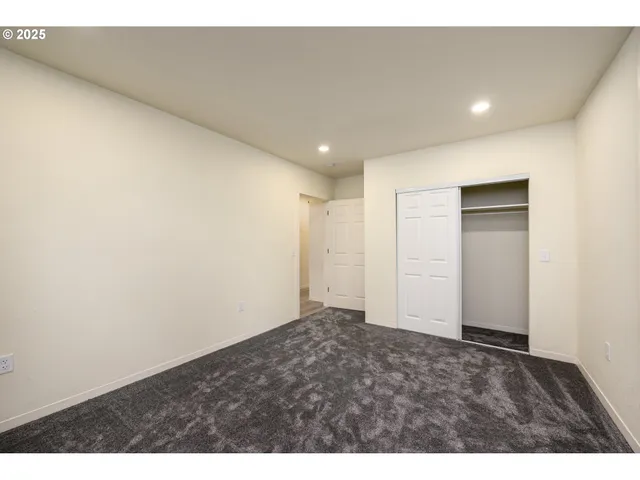 a view of entryway with wooden floor and stairs