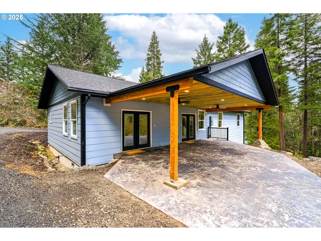 a view of a wooden deck with a backyard