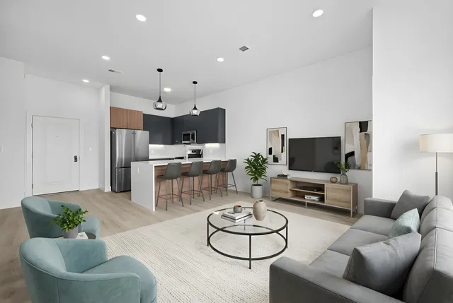 a living room with furniture and a flat screen tv