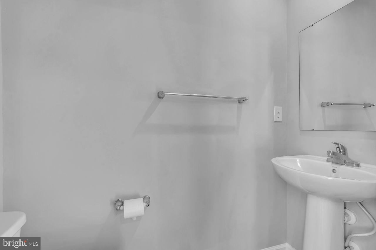 1 Wendowski Street Beverly, NJ 08010 - Photo 14 of 50 a bathroom with a sink a mirror and a shower