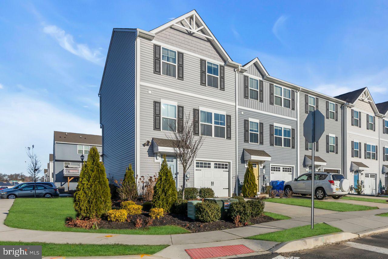 1 Wendowski Street Beverly, NJ 08010 - Photo 2 of 50 a front view of a building with a garden and plants