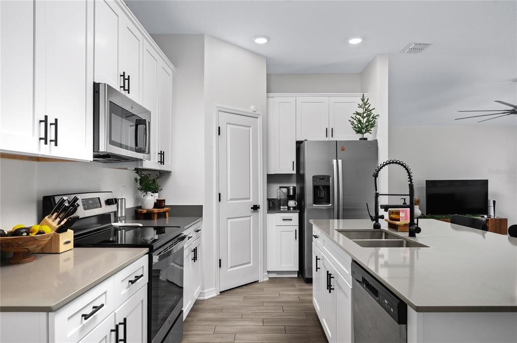 2518 Hoptree Lane Edgewater, FL 32141 - Photo 2 of 28 a kitchen with stainless steel appliances granite countertop a stove a sink dishwasher and a refrigerator