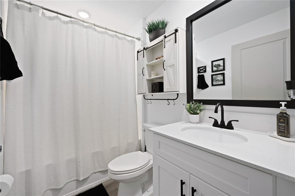 2518 Hoptree Lane Edgewater, FL 32141 - Photo 21 of 28 a bathroom with a sink toilet and shower