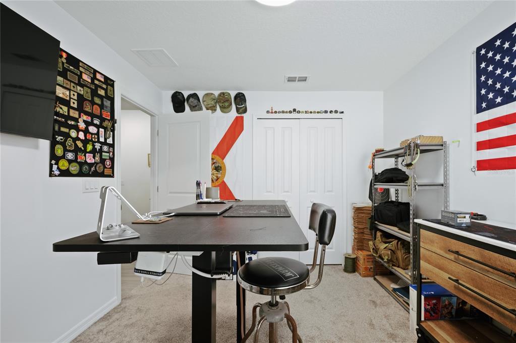 2518 Hoptree Lane Edgewater, FL 32141 - Photo 23 of 28 a view of a workspace with furniture
