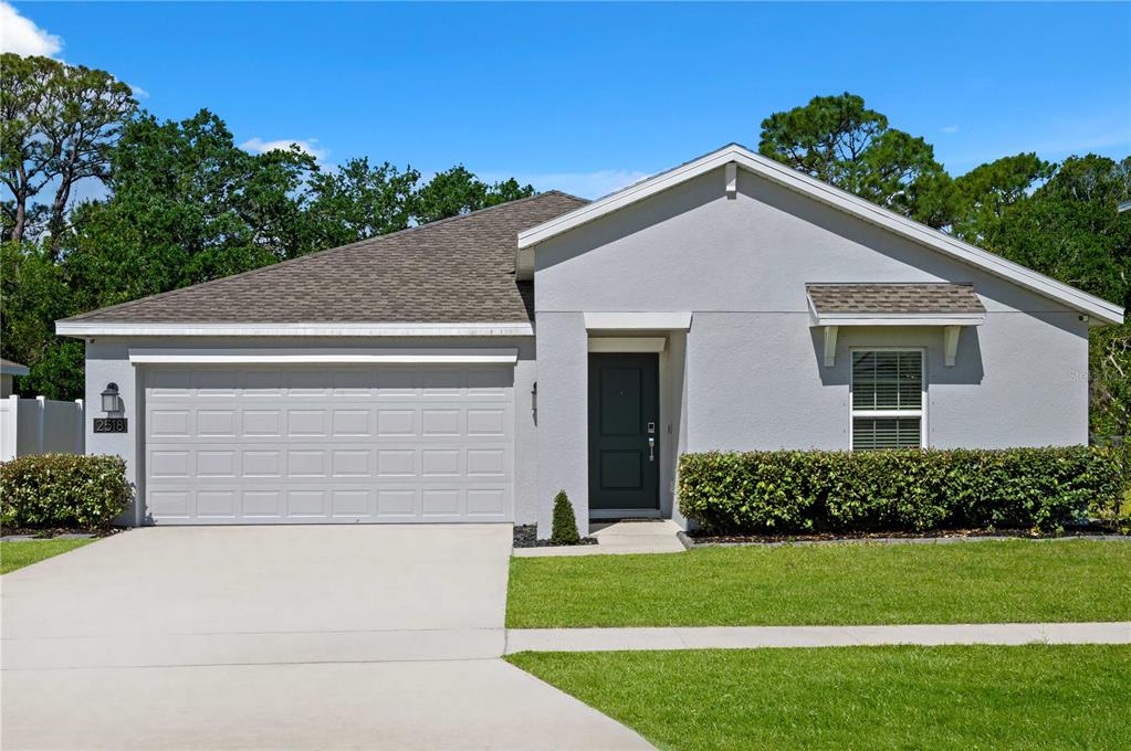 2518 Hoptree Lane Edgewater, FL 32141 - Photo 25 of 28 a view of a house with a yard