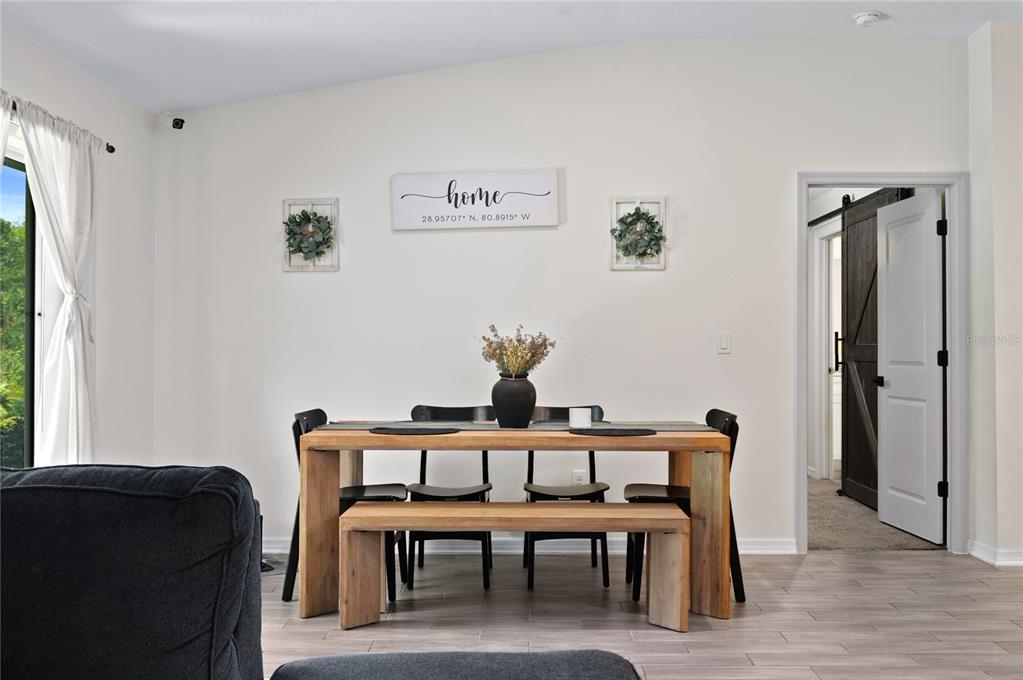 2518 Hoptree Lane Edgewater, FL 32141 - Photo 10 of 28 a dining room with furniture and window