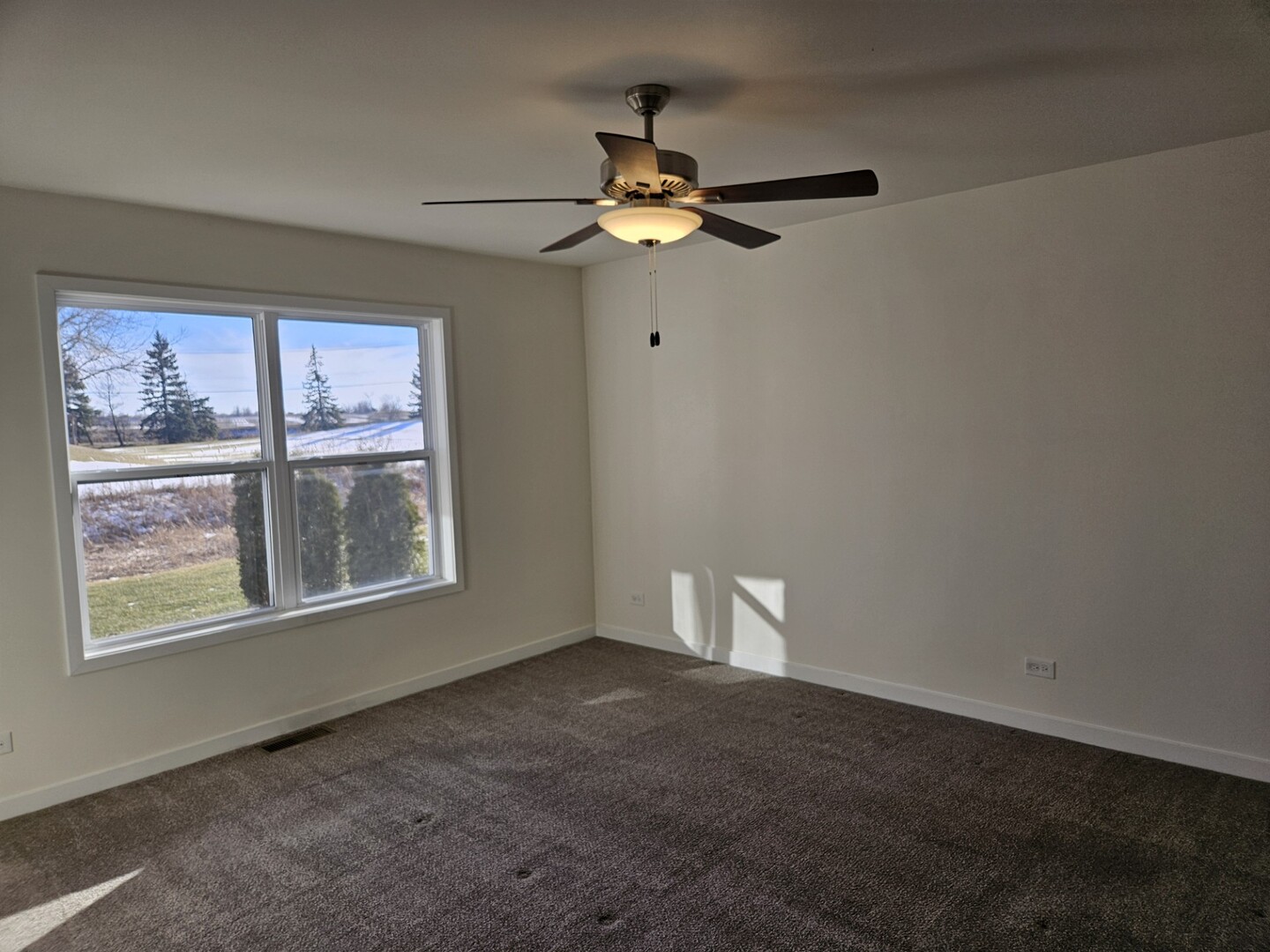 69 Olympus Drive Tinley Park, IL 60477 - Photo 4 of 8 a view of empty room with window