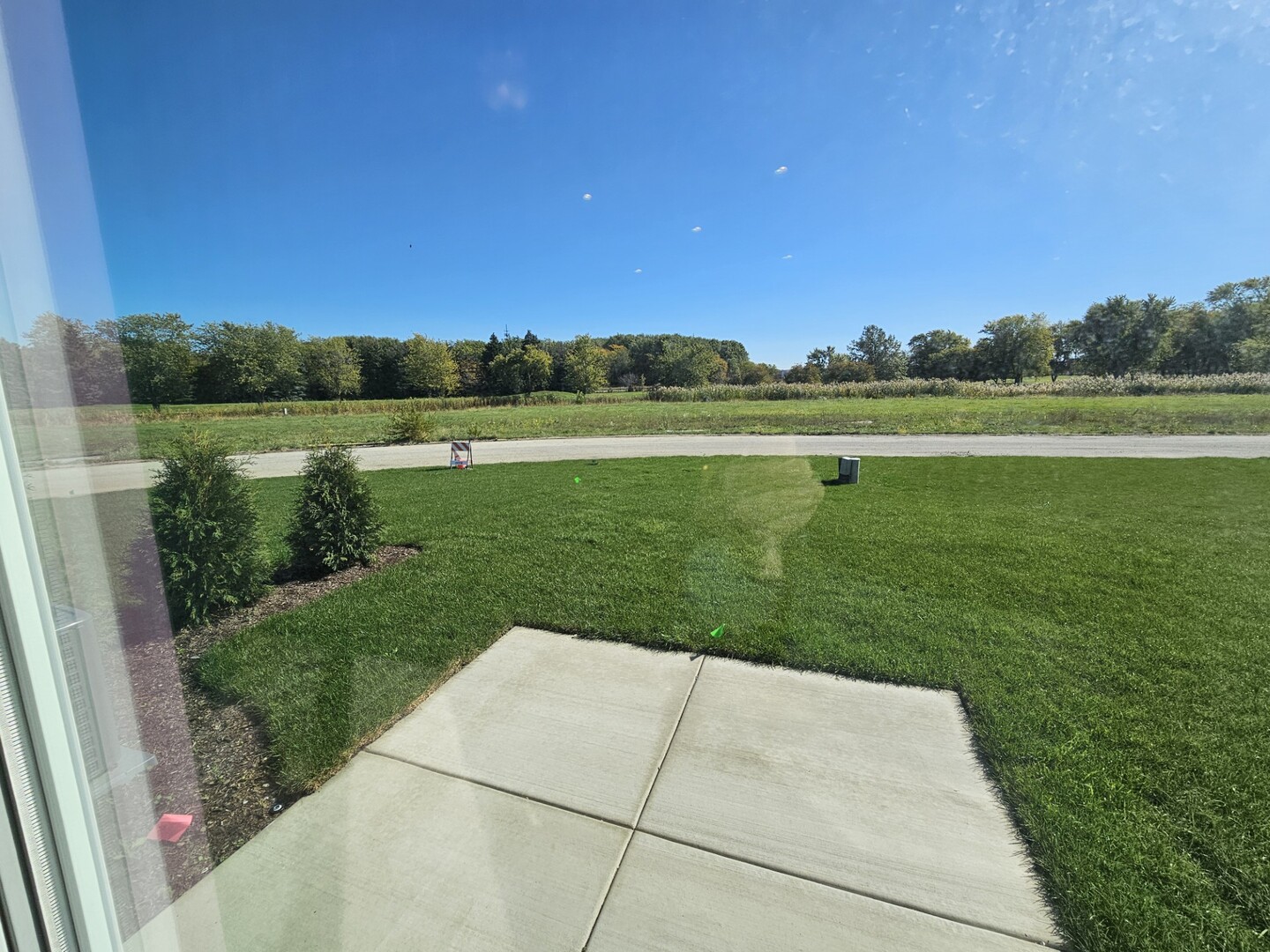 69 Olympus Drive Tinley Park, IL 60477 - Photo 8 of 8 a view of a lake with a big yard