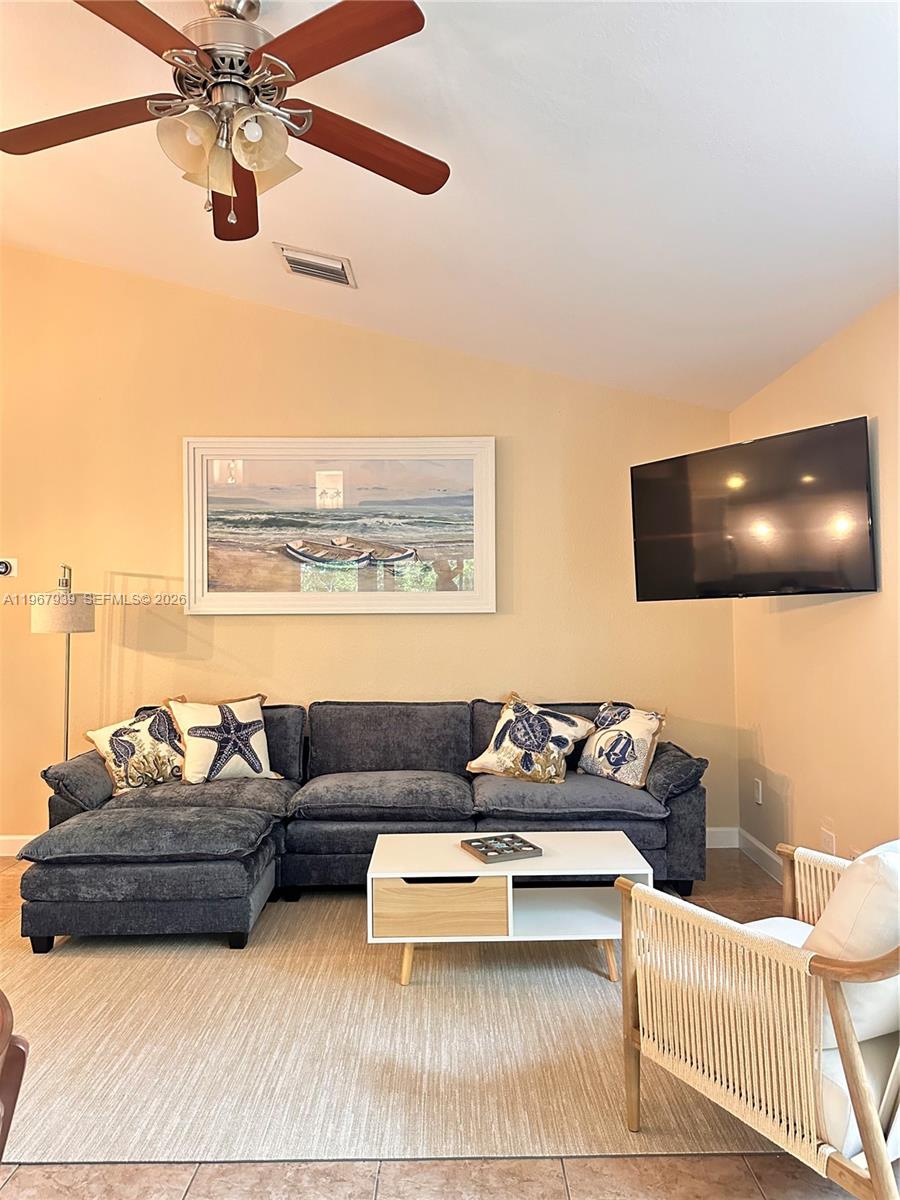 24 Tarpon Avenue Key Largo, FL 33037 - Photo 17 of 22 a living room with furniture and a flat screen tv