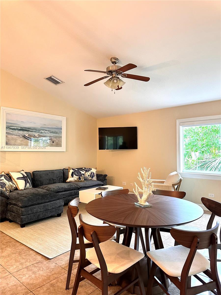 24 Tarpon Avenue Key Largo, FL 33037 - Photo 18 of 22 a view of a dining room with furniture and window