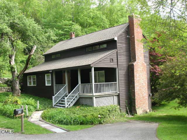 128 Camps Flat Road Kent, CT 06785 - Photo 1 of 1 a front view of a house with a yard