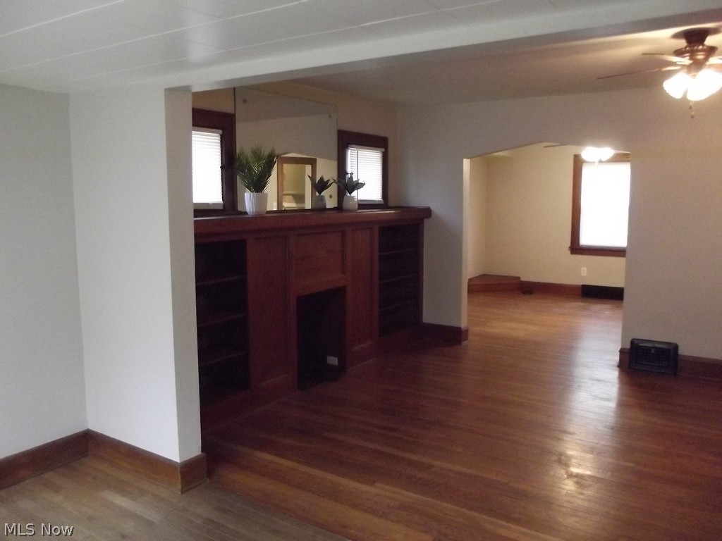 3363 Berea Road Cleveland, OH 44111 - Photo 16 of 50 Unfurnished living room with ceiling fan and dark wood-type flooring