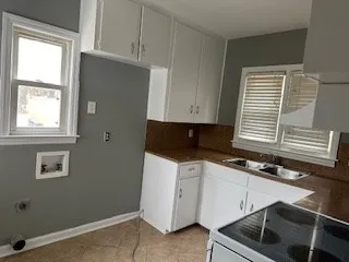 a kitchen with a sink and cabinets