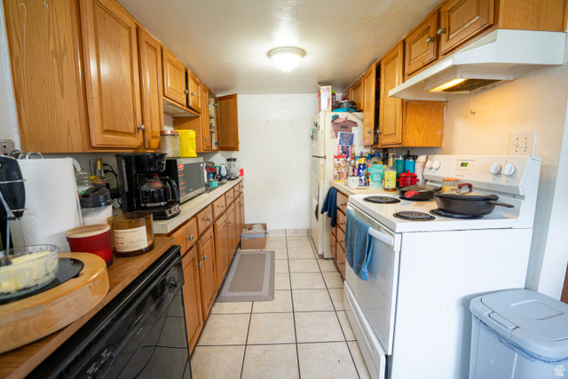 1347 South 400 East Springville, UT 84663 - Photo 6 of 20 Kitchen featuring light wood cabinetry, white countertops, tile flooring, and a white electric range