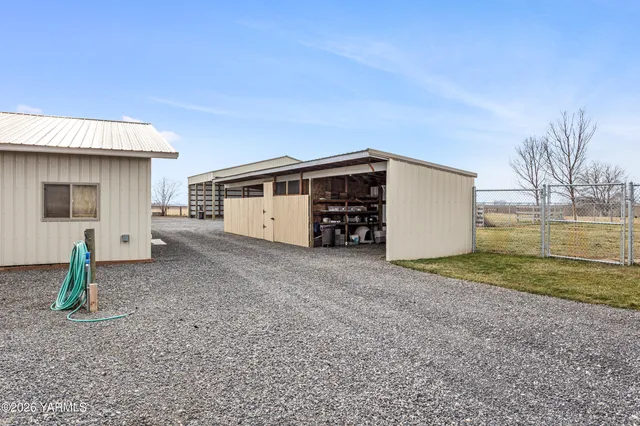 a living room with furniture and a dining table with kitchen view