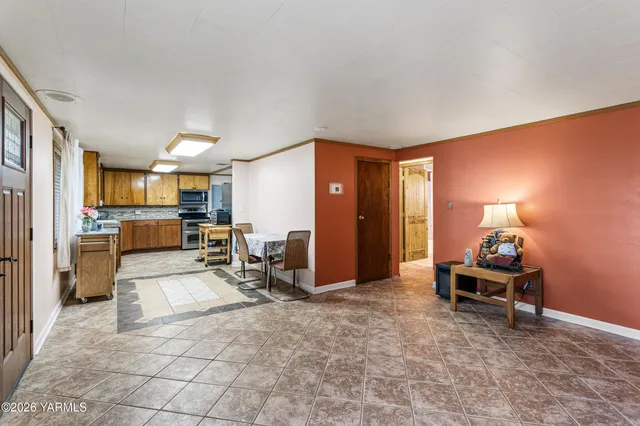 a view of a workspace with furniture and a flat screen tv