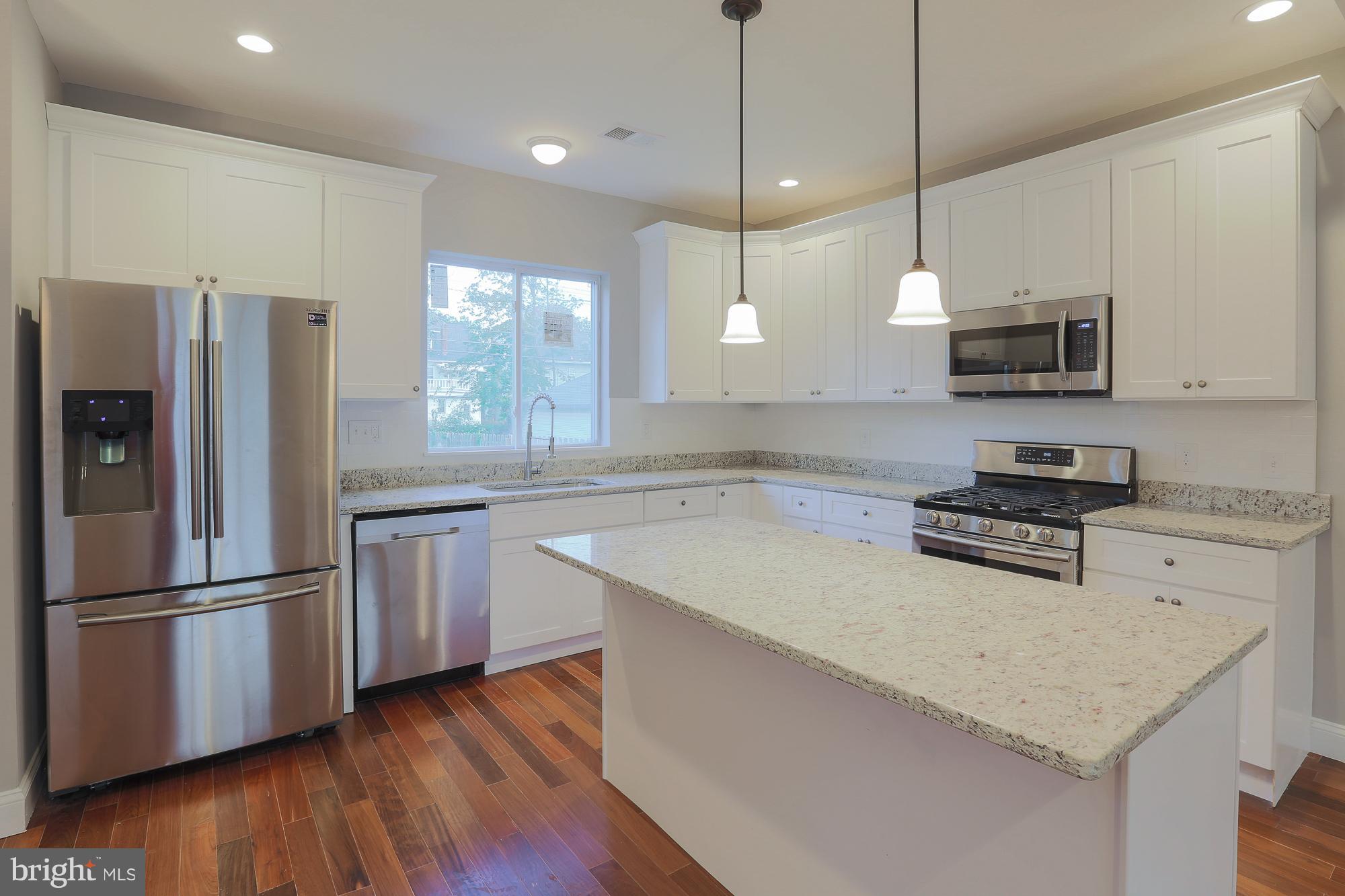 4216 Ridgewood Avenue Baltimore, MD 21215 - Photo 4 of 29 Gourmet kitchen with island & SS appliances