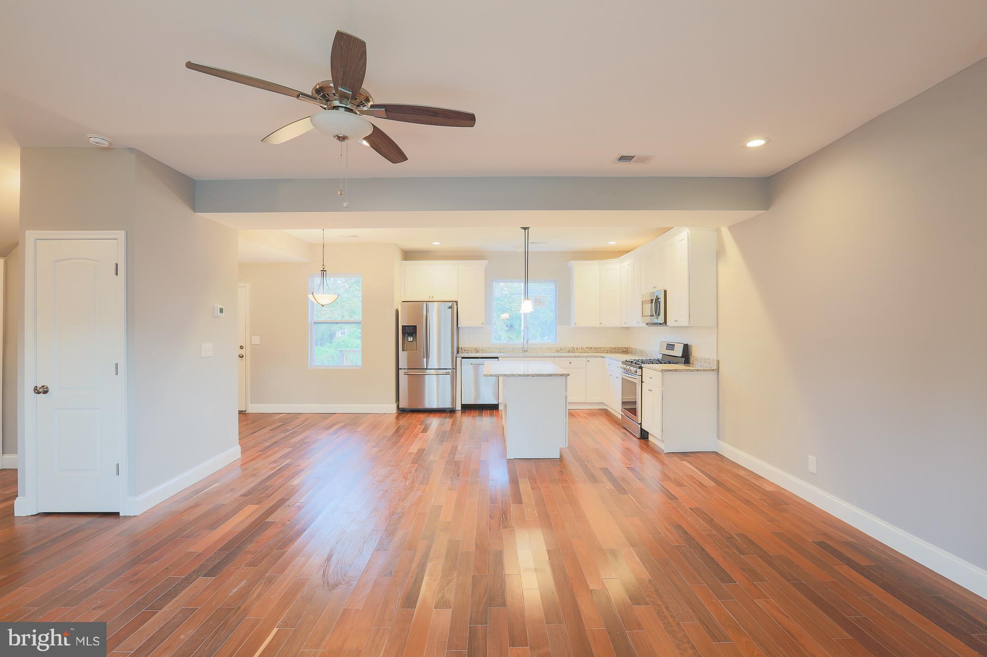 4216 Ridgewood Avenue Baltimore, MD 21215 - Photo 29 of 29 Open floor plan with hardwood