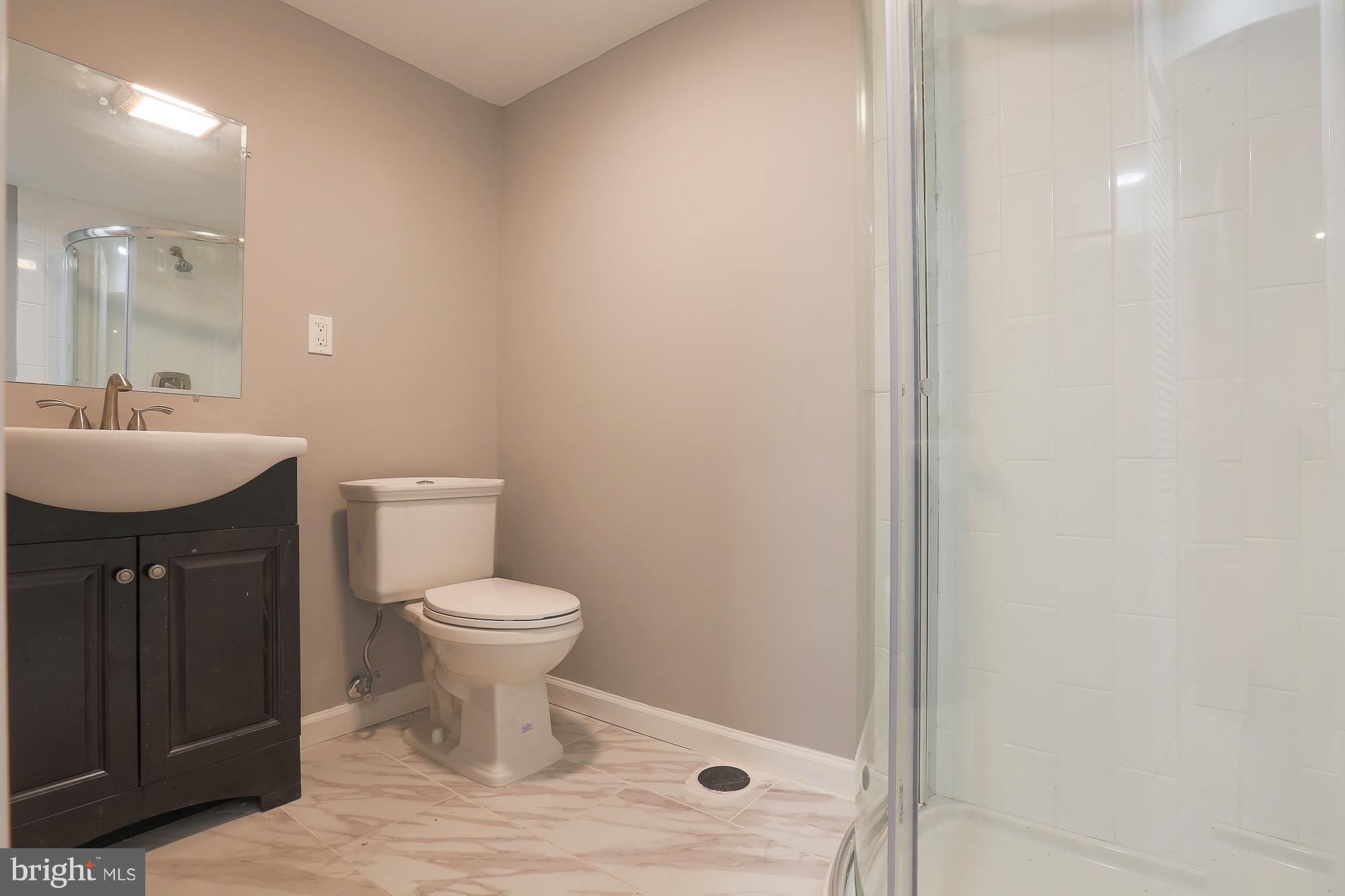 4216 Ridgewood Avenue Baltimore, MD 21215 - Photo 7 of 29 Full bath downstairs with water efficient flush
