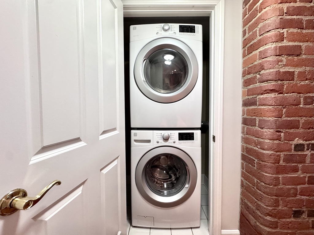 4 Bishop Street, Unit G11 Framingham, MA 01702 - Photo 11 of 24 a utility room with dryer and washer