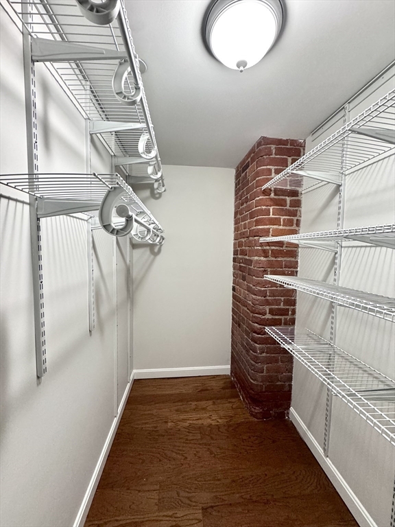 4 Bishop Street, Unit G11 Framingham, MA 01702 - Photo 17 of 24 a view of walk in closet with empty racks
