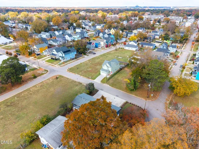 an aerial view of residential houses with outdoor space