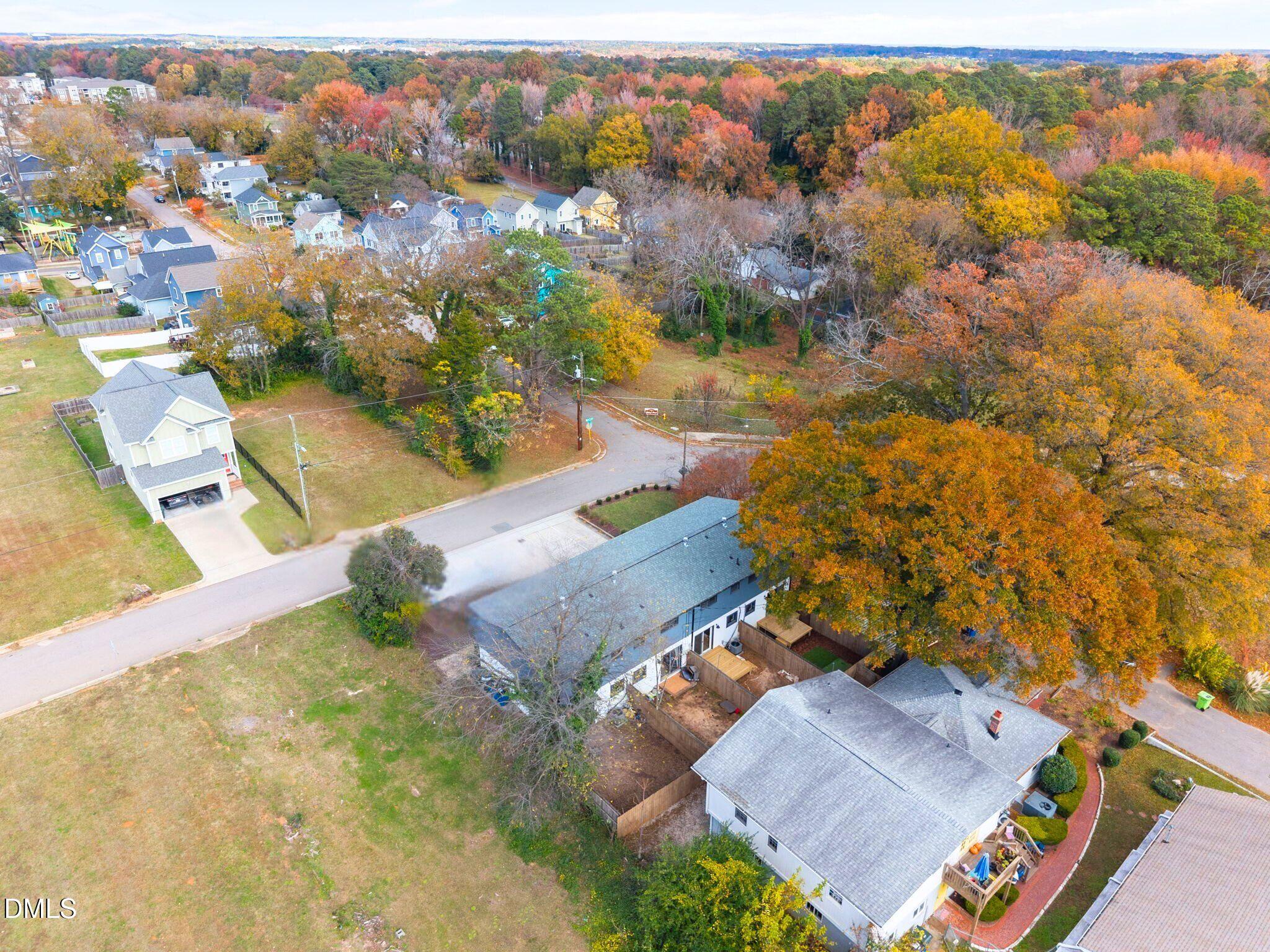 15 North Fisher Street Raleigh, NC 27610 - Photo 9 of 14 an aerial view of residential houses with outdoor space