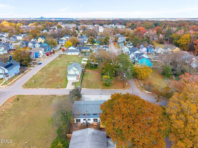 an aerial view of a house with a swimming pool
